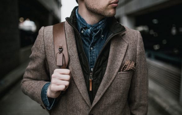 Attractive guy wearing a brown coat